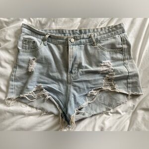 Distressed light denim shorts